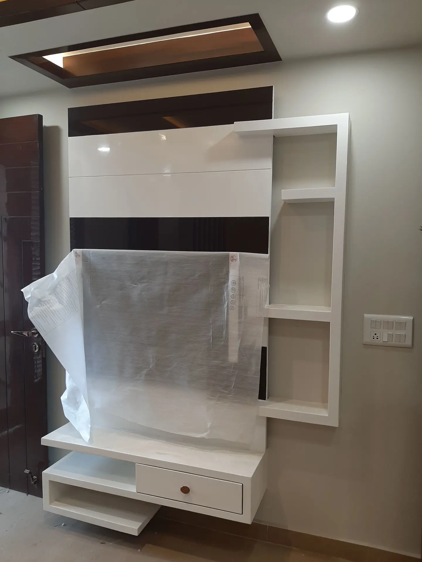 Bedroom TV wall and storage concept